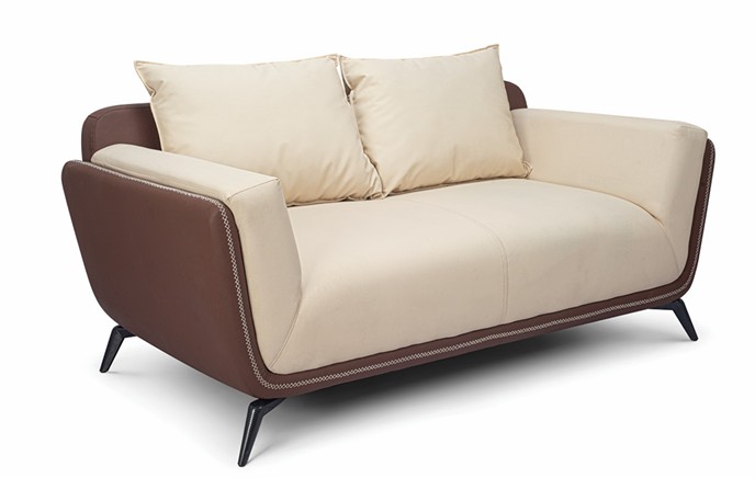 Two-seater sofa in cream and brown leather with accent cushions